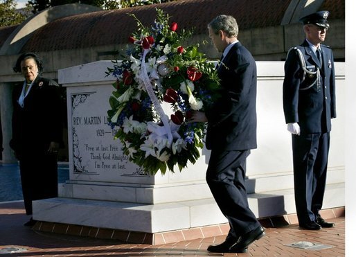 President George W. Bush and Coretta Scott King, left, participate in a wreath lay ceremony at the grave of Dr. Martin Luther King JR. in Atlanta, Georgia, Thursday, Jan. 15, 2004. White House photo by Eric Draper