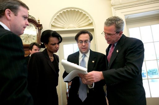 President George W. Bush reviews his State of the Union speech in the Oval Office Tuesday morning, January 20, 2004, with Communications Director Dan Bartlett, at left, Staff Secretary Brett Kavanaugh, National Security Adviser Condoleezza Rice and Mike Gerson, Director of Presidential Speech Writing. White House photo by Eric Draper