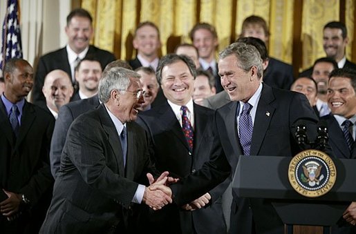 Shaking hands with manager Jack McKeon, President George W. Bush hosts a visit by the 2003 World Series Champions, the Florida Marlins, to the White House Friday, Jan. 23, 2004. White House photo by Paul Morse