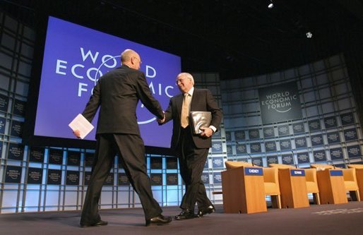 Vice President Dick Cheney greets professor Klaus Schwab, founder and president of the World Economic Forum, before addressing more than 1,000 attendees at World Economic Forum in Davos, Switzerland Jan. 24, 2004. During his speech, Vice President Cheney said international cooperation is required to win the war on terror. "We must meet the dangers together. Cooperation among our governments, and effective international institutions, are even more important today than they have been in the past." White House photo by David Bohrer.
