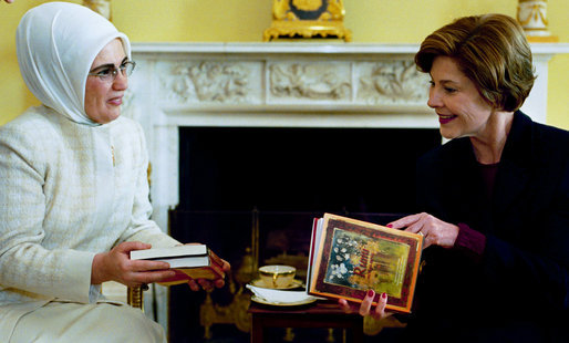 Laura Bush accepts books of poetry by Turkish poet Rumi presented by Emine Erdogan, wife of the Prime Minister of Turkey, during a coffee at the White House Thursday, Jan. 29, 2004. White House photo by Susan Sterner