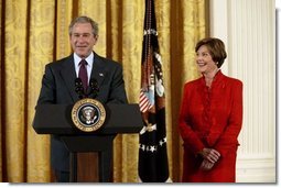 President George W. Bush and Laura Bush talk about heart disease as the number-one killer of all Americans during White House ceremonies to launch American Heart Month Monday, Feb. 2, 2004. The event, part of the national Heart Truth campaign, was held to highlight the issue of heart disease and women.  White House photo by Susan Sterner