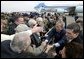 President George W. Bush greets military personnel at Charleston Air Force Base before departing Charleston, S.C., Feb. 5, 2004. White House photo by Paul Morse
