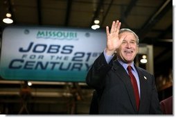 President George W. Bush acknowledges the audience shortly before participating in a conversation on the economy at SRC Automotive in Springfield, Mo., Monday, Feb. 9, 2004.  White House photo by Eric Draper