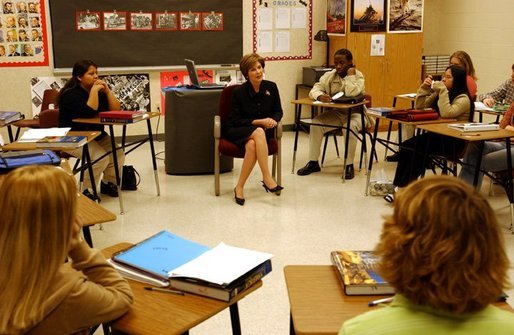 Laura Bush talks with history students at Bentonville High School in Bentonville, Ark., Tuesday, Feb. 17, 2004. "We'll need more than 2 million new teachers in America's classrooms in the next decade," said Mrs. Bush in her remarks about education. "We want teachers with diverse academic backgrounds who will commit to teaching in urban or rural public schools, where teachers are desperately needed." White House photo by Tina Hager