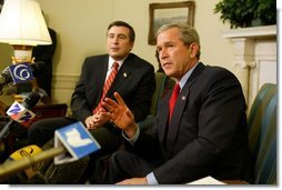 President George W. Bush answers questions from the press after meeting with the president of Georgia Mikhail Saakashvili in the Oval Office on February 25, 2004.  White House photo by Paul Morse