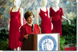 Laura Bush makes remarks during her tour of the Red Dress Project exhibit at the New Orleans Convention Center March 8, 2004.  White House photo by Tina Hager