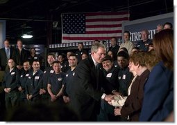 President George W. Bush greets employees of USA Industries, after a conversation on the economy and job training in Bay Shore, New York, Thursday, March 11, 2004.  White House photo by Eric Draper