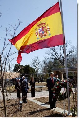 Honoring the victims of terrorist bombings in Spain, President George W. Bush bows his head in silence during a wreath-laying ceremony at the Spanish ambassadors' residence in Washington, D.C., Friday, March 12, 2004.   White House photo by Paul Morse