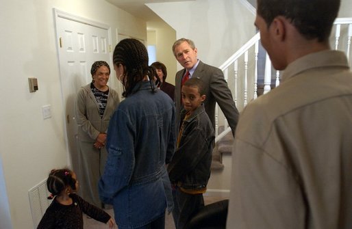 President George W. Bush visits with Pearl Cerdan and her four children in Ardmore, Pa., Monday, March 15, 2004. Ms. Cerdan, a first-time homebuyer, moved into her Spring Avenue Development home in December of 2003. White House photo by Tina Hager
