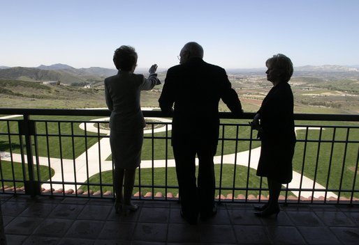 Looking over a replica of the White House South Lawn, former First Lady Nancy Reagan leads Vice President Dick Cheney and Mrs. Lynne Cheney on a tour of the Ronald Reagan Presidential Library and Museum in Simi Valley, Calif., Wednesday, March 17, 2004. White House photo by David Bohrer.