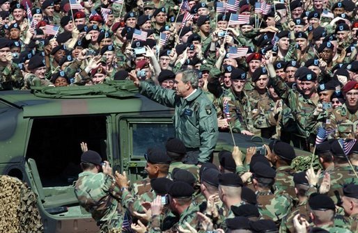 President George W. Bush and Laura Bush are welcomed by military personnel, including the 101st Airborne Division, at Fort Campbell, Ky., Thursday, March 18, 2004. "Fort Campbell was the first army post I visited in the weeks after our country was attacked," said the President during his remarks. Continuing his remarks, the President said, "Since we last met, you deployed over 5,000 vehicles, 254 aircraft, and 18,000 soldiers in Kuwait, in the fastest deployment in the history of the 101st." White House photo by Tina Hager