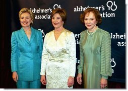 Accompanied by former first ladies Sen. Hillary Rodham Clinton, left, and Rosalynn Carter, Laura Bush attends the inaugural gala for the Alzheimer's Association in Washington, D.C., Wednesday, March 24, 2004. "I know how hard it is to lose someone to Alzheimer's disease. I lost my father seven years ago, so this subject is never far from my heart," said Mrs. Bush in her remarks.  White House photo by Tina Hager