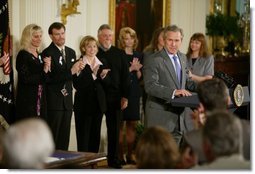 President George W. Bush speaks before signing H.R. 1997, the Unborn Victims of Violence Act of 2004, in the East Room Thursday, April 1, 2004.  White House photo by Paul Morse