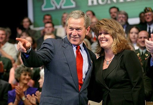 President George W. Bush acknowledges the family of stage participant and student Rina Angus during a conversation on job training at Marshall Community & Technical College in Huntington, W.Va., Friday, April 2, 2004. White House photo by Eric Draper