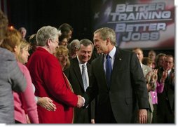 President George W. Bush greets the audience after his remarks on job training and the economy at Central Piedmont Community College in Charlotte, N.C., Monday, April 5, 2004.  White House photo by Eric Draper