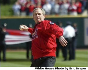 President George W. Bush throws out the first pitch during the St. Louis Cardinals. season opener against the Milwaukee Brewers at Busch Stadium in St. Louis, Mo., Monday, April 5, 2004.