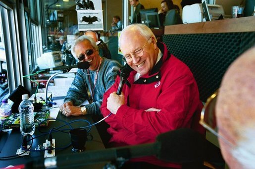 Vice President Dick Cheney talks with WLW-AM radio hosts after throwing out the first pitch on opening day in Cincinnati, Ohio at the Red's Great American Ballpark on April 5, 2004. White House photo by David Bohrer