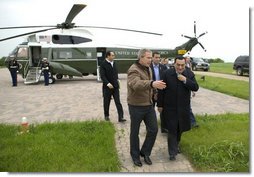 President George W. Bush escorts President Hosni Mubarak of Egypt after his arrival at the Bush Ranch in Crawford, Texas, Monday, April 12, 2004.  White House photo by Eric Draper