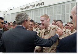President George W. Bush talks with Robert Jackson of the 186th Military Police Company at the Iowa Air National Guard Base in Des Moines, Iowa, Thursday, April 15, 2004. Jackson was injured while serving in Iraq.  White House photo by Paul Morse
