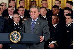 President George W. Bush speaks during the presentation of the Commander-In-Chief Trophy to the U.S. Naval Academy football team in the East Room Monday, April 19, 2004. The trophy is awarded to the Service Academy with the year's best overall record in NCAA football games versus the other academies.  White House photo by Tina Hager