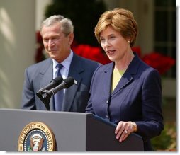 President George W. Bush and First Lady Mrs. Laura Bush at the 2004 Teacher of the Year award program in the Rose Garden of the White House on April 21, 2004.  White House photo by Paul Morse