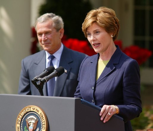 President George W. Bush and First Lady Mrs. Laura Bush at the 2004 Teacher of the Year award program in the Rose Garden of the White House on April 21, 2004. White House photo by Paul Morse