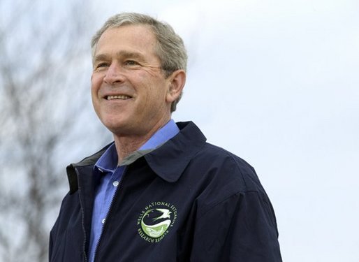 President George W. Bush smiles during his introduction before delivering remarks on Earth Day at Wells National Estuarine Research Reserve in Wells, Maine, Thursday, April 22, 2004. "The importance about Earth Day is that it reminds us that we can't take the natural wonders for granted. That's what Earth Day says to me, and I hope it says to you, as well, that we have responsibilities to the natural world to conserve that which we have and to make it even better," said the President in his remarks. White House photo by Eric Draper.