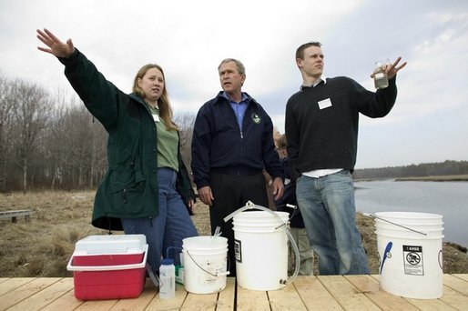 President George W. Bush participates in a water testing project with Education Director Laura Lubelczyk, left, and volunteer Trak Lord at the Wells National Estuarine Research Reserve with in Wells, Maine, Thursday, April 22, 2004. In his remarks, President Bush discussed the value of volunteering in places like the reserve, "But what makes this beautiful part of the world go is the 400 volunteers who work here -- the 400 volunteers who are exercising their responsibility as citizens to make this beautiful part of the world even more beautiful and more meaningful." White House photo by Eric Draper.