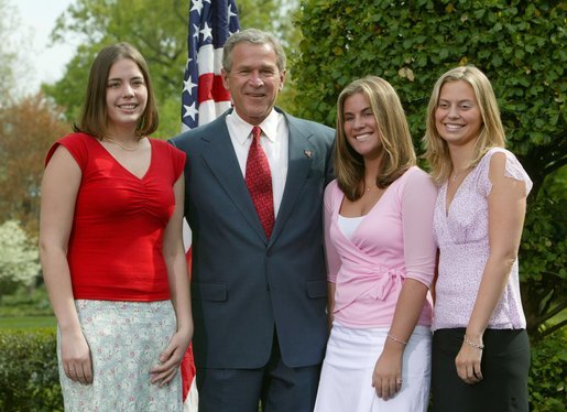 President George W. Bush congratulates, from left to right, Emily Slayton, 19, Jessica Herbrand, 19, and Kristin Fitzer, 19, of the Eatonville High School Salmon Enhancement Group of Eatonville, Wash., on receiving the President’s Environmental Youth Award in the East Garden April 22, 2004. White House photo by Susan Sterner.