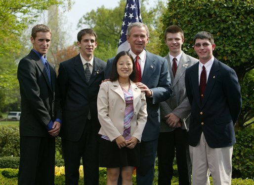 President George W. Bush congratulates the 4-H Adopt-A-Stream Club of Newnan, Ga., on receiving the President’s Environmental Youth Award in the East Garden April 22, 2004. White House photo by Susan Sterner.