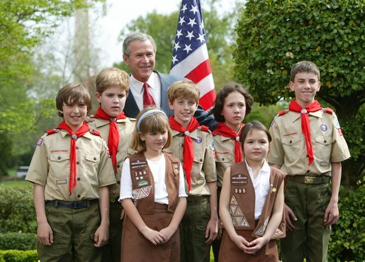 President George W. Bush congratulates the Dodge Elementary Scouts for Wetland Habitat Enhancement of East Amherst, N.Y., on receiving the President’s Environmental Youth Award in the East Garden April 22, 2004. White House photo by Susan Sterner.