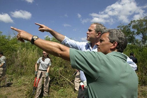 President George W. Bush tours Rookery Bay National Estuarine Research Reserve with its director Gary Lytton in Naples, Fla., Friday, April 22, 2004. "Of all the coastal wetlands in the lower 48 states, 20 percent are right here in Florida. This is a legacy we need to protect and pass along," said the President in his remarks. White House photo by Eric Draper