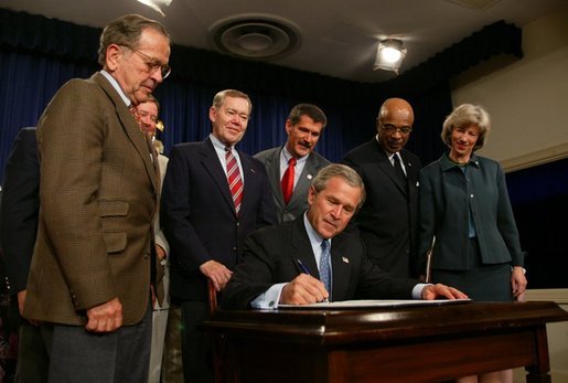 President George W. Bush signs into effect the Indian Education Executive Order in Room 450 of the Old Executive Building on April 30, 2004. White House photo by Paul Morse