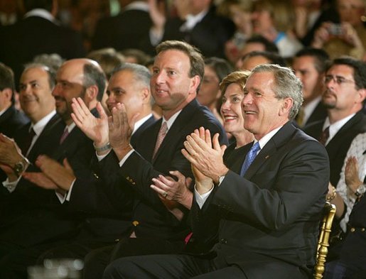 Sitting with the U.S. Ambassador to Mexico Tony Garza, President George W. Bush and Laura Bush applaud the performances during a White House ceremony honoring Cinco de Mayo in the East room Wednesday, May 5, 2004. "The great triumph of Mexican forces on May the 5th, 1862, has inspired liberty-loving people everywhere, and it's helped shape the character of modern Mexico," said the President remarked on the history of the date. "Against great odds, a small and under-equipped army defeated the skilled army of a European power. We've had that experience in America, too." White House photo by Paul Morse