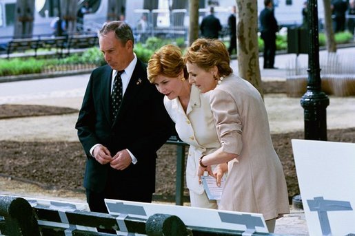 Laura Bush views drawings for the "Gardens of Remembrance," a September 11th memorial, with Mrs. Warrie Price, Founder and President of The Battery Conservancy, and New York City Mayor Michael Bloomberg in New York's Battery Park Monday, May 10, 2004. White House photo by Tina Hager