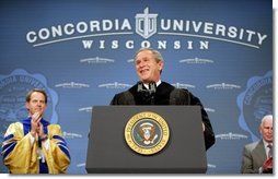President George W. Bush is greeted with cheers as he begins his address at the commencement ceremonies for Concordia University near Milwaukee, Wis., Friday, May 14, 2004.  White House photo by Paul Morse