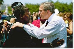 President George W. Bush talks with a woman attending the Annual Peace Officers' Memorial Service at the U.S. Capitol in Washington, D.C., Saturday, May 15, 2004.  White House photo by Paul Morse