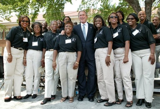 President George W. Bush poses for a photograph with the 16th Street Baptist Church Choir of Birmingham, Ala., at the Brown V. Board of Education National Historic Site in Topeka, Kan., Monday, May 17, 2004. White House photo by Eric Draper.
