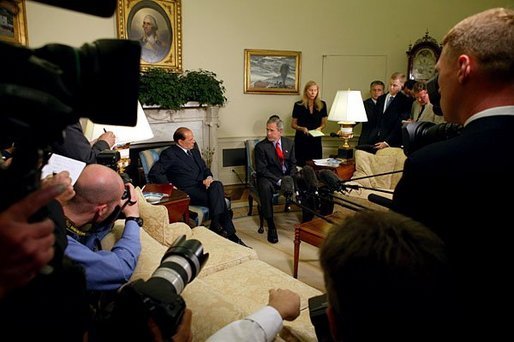 President George W. Bush and Prime Minister Silvio Berlusconi of Italy make a joint statement to the press in the Oval Office Wednesday, May 19, 2004. The two leaders discussed the development of a strategy for the full transfer of sovereignty to an interim Iraqi government June 30. White House photo by Joyce Naltchayan.