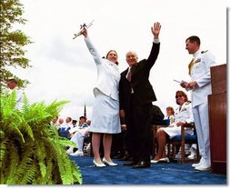Following his commencement address to the U.S. Coast Guard Academy, Vice President Dick Cheney and Cadet Jen Frye, 22, of New Market, Va., wave to her friends and family after he presented the graduating cadet her commission in New London, Conn., Wednesday, May 19, 2004.  White House photo by David Bohrer