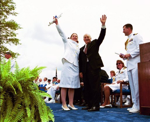 Following his commencement address to the U.S. Coast Guard Academy, Vice President Dick Cheney and Cadet Jen Frye, 22, of New Market, Va., wave to her friends and family after he presented the graduating cadet her commission in New London, Conn., Wednesday, May 19, 2004. White House photo by David Bohrer.