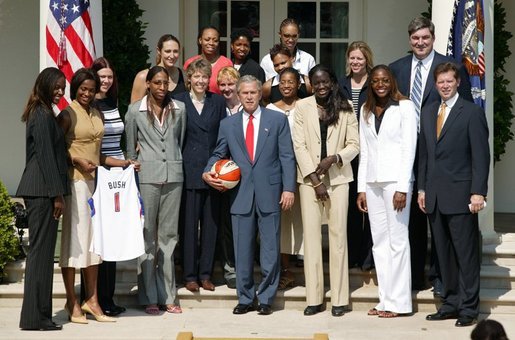 President George W. Bush takes a team photo with the Detroit Shock, the 2003 WNBA champions in the Rose Garden on May 24, 2004. White House photo by Paul Morse.
