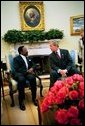 President George W. Bush and President Omar Bongo Ondimba of Gabon meet in the Oval Office Wednesday, May 26, 2004. White House photo by Eric Draper.