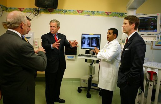 President George W. Bush listens to a demonstration by Dr. Neal Patel on the benefits of using information technology in hospitals at Vanderbilt Children’s Hospital in Nashville, Tenn., May 27, 2004. White House photo by Paul Morse