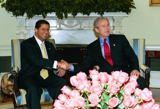 President George W. Bush meets with President Francisco Flores Perez of El Salvador in the Oval Office Thursday, May 27, 2004. White House photo by Joyce Naltchayan