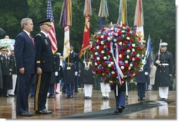 President George W. Bush stands at attention during Wreath Laying ceremonies in commemoration of Memorial Day at Arlington National Cemetery in Arlington, Virginia Monday May 31, 2004.  White House photo by Joyce Naltchayan
