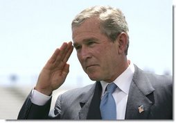 President George W. Bush salutes a graduating cadet at the United States Air Force Academy Graduation Ceremony in Colorado Springs, Colorado, June 2, 2004.  White House photo by Eric Draper