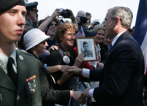 President George W. Bush meets with veterans and their families after delivering remarks during ceremonies marking the 60th anniversary of D-Day at the American Cemetery in Normandy, France, June 6, 2004. White House photo by Paul Morse.
