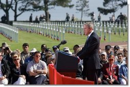 President George W. Bush addresses World War II veterans and families during the 60th anniversary of D-Day at the American Cemetery in Normandy, France, June 6, 2004.  White House photo by Paul Morse